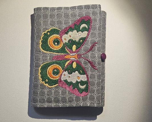 front of grey notrbook with embroidery