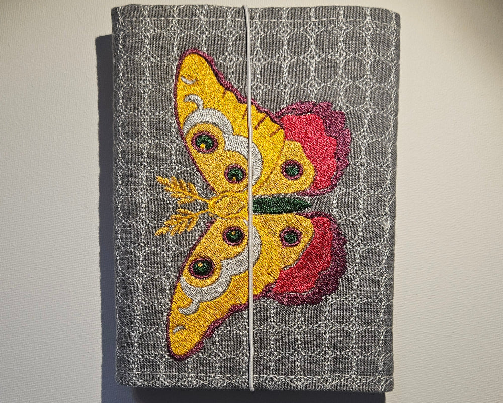 back of grey notbook with embroidery